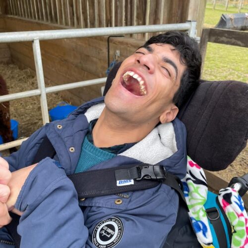 Waqas laughingstocks Young man in wheelchair laughing
