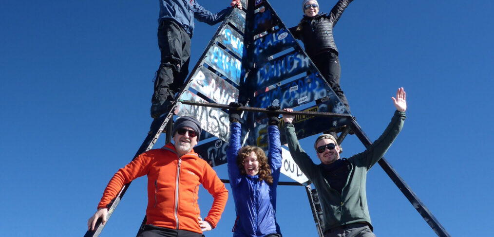People celebrating on the summit of Mount Toubkal